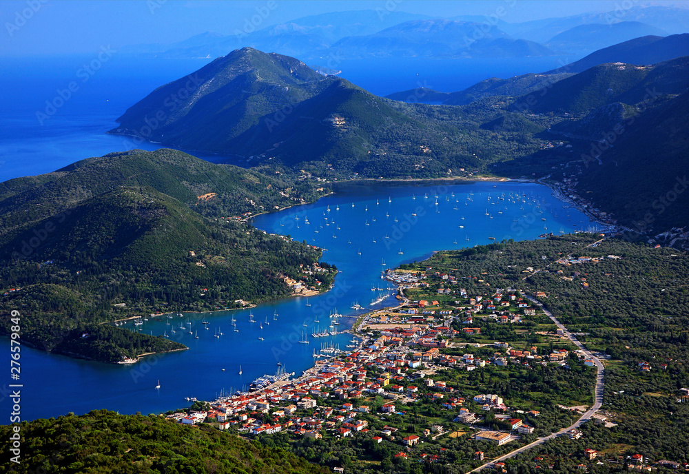 LEFKADA ISLAND, IONIAN SEA, GREECE. Panoramic view of Vlychos bay and Nydri town from Skaroi mountain. 