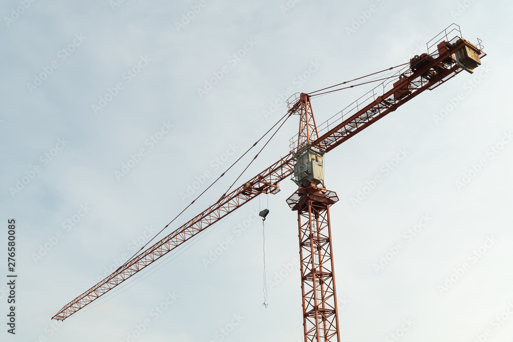 Construction crane with blue sky background.