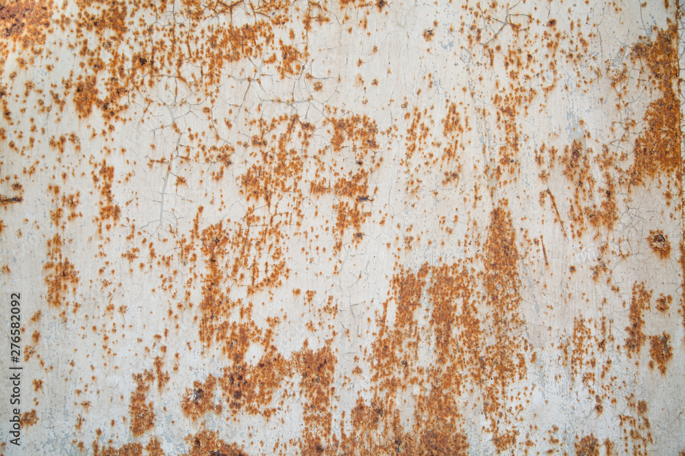 The background is made of old stainless steel sheet with cracks in the paint, there is room for text. Design backgrounds texture. The background is made of old stainless steel sheet with cracks in the paint, there is room for text. Design backgrounds texture.