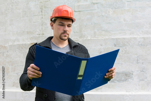 young engineer studying documentation
