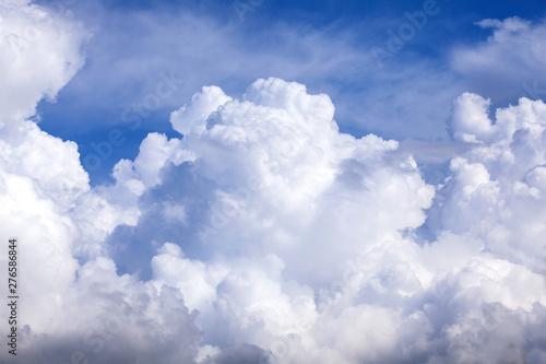 Puffy clouds blue sky