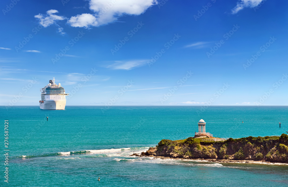 Luxury Cruise ship sailing to port on sunny day