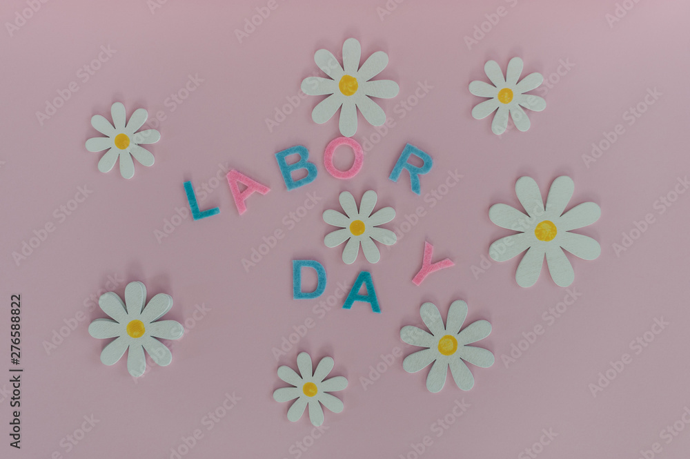 The inscription labor Day on a beautiful pink background. Holiday weekend in September The inscription labor Day on a beautiful pink background. Holiday weekend in September