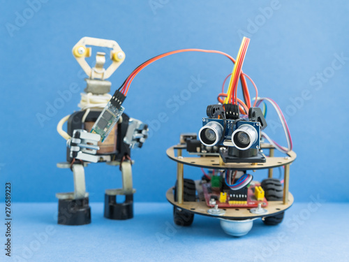 Back to school concept. A metal robot. Robotics and electronics. DIY robotics. STEM and STEAM education for kids. Free space for text.