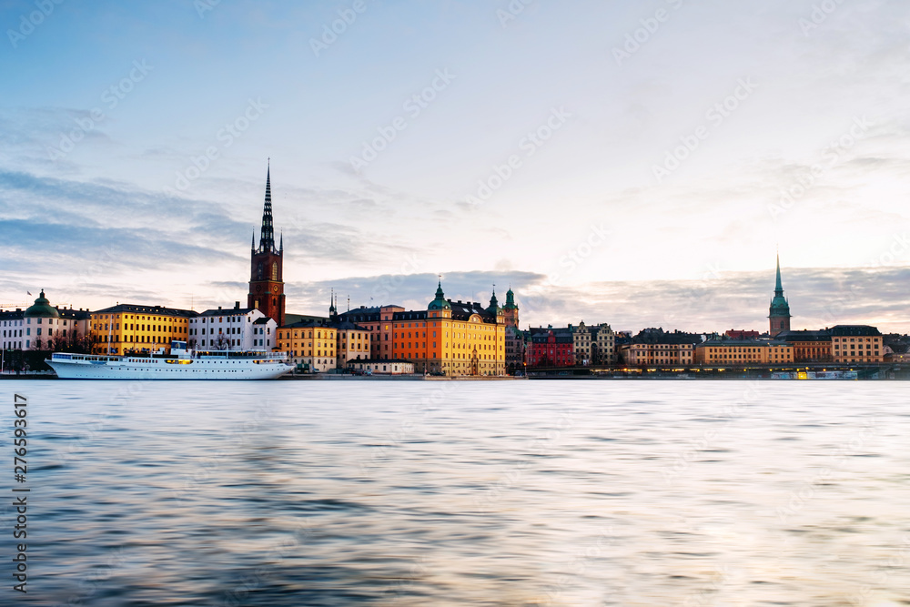 View of Gamla Stan in Stockholm, Sweden with landmarks like Riddarholm Church during the sunrise