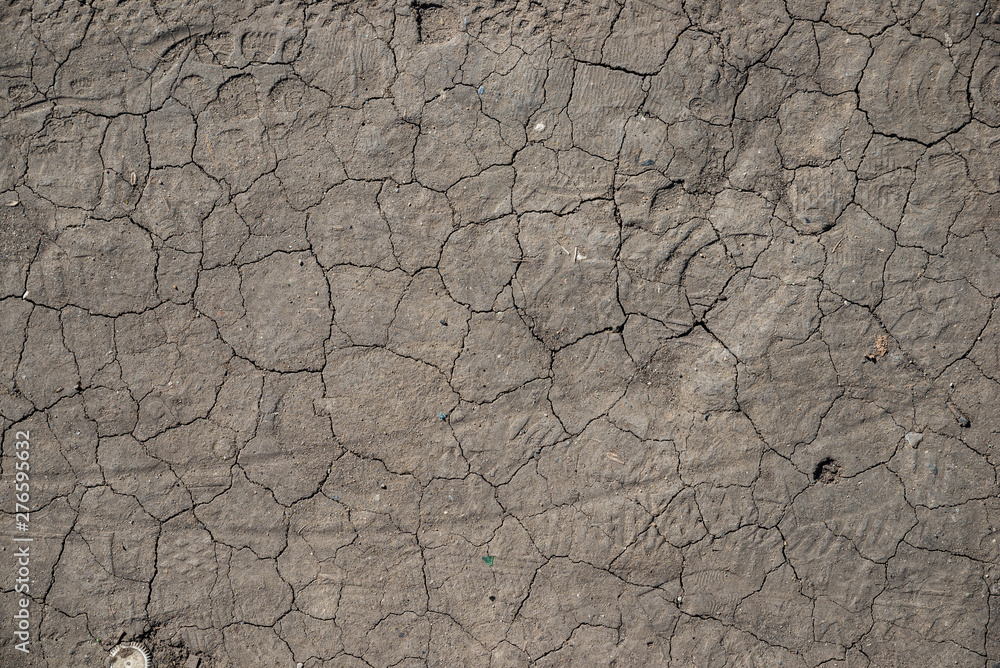 The texture of the cracks on the dry land during a drought The texture of the cracks on the dry land during a drought