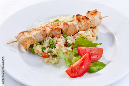 chicken kebab with rice and vegetables