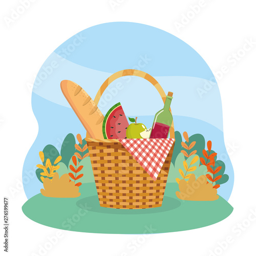 hamper with bread and watermelon with wine bottle