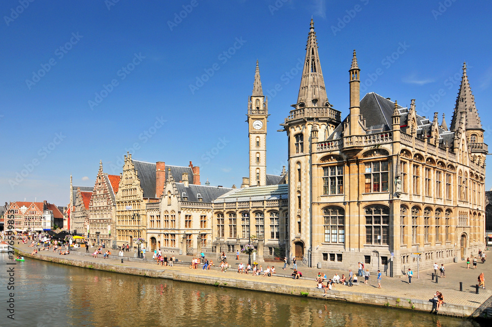 Obraz premium Picturesque medieval buildings overlooking the Graslei harbor on Leie river in Ghent town Belgium Europe.