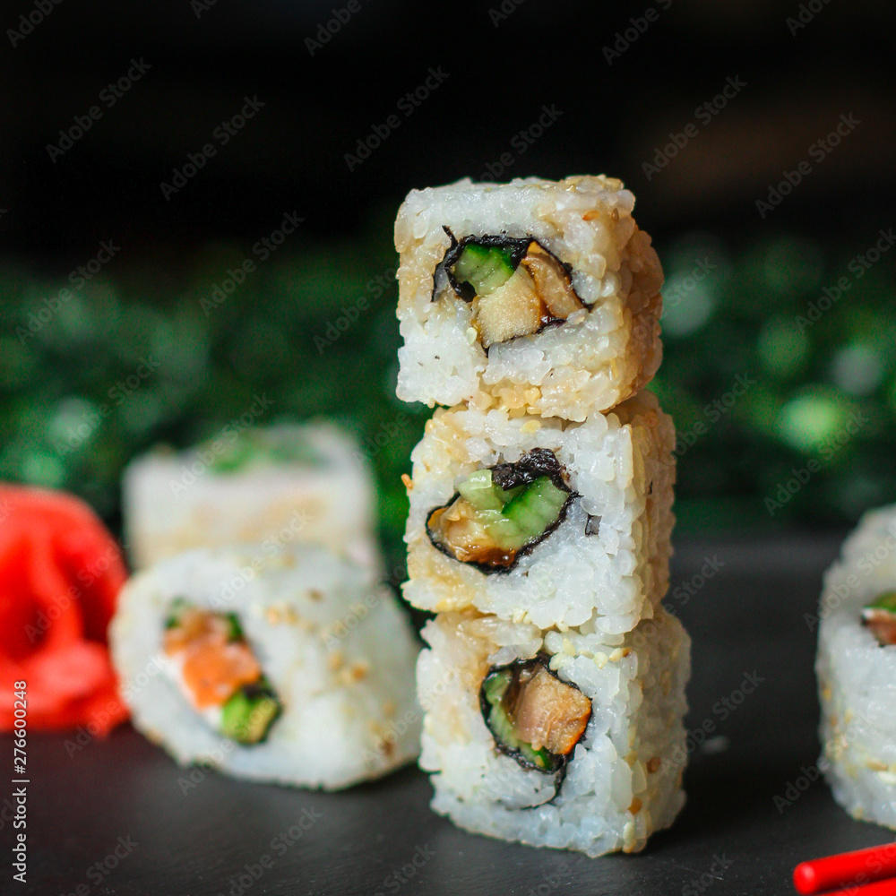 Sushi maki rolls (tuna, salmon, shrimp, avocado and other ingredients). japanese food. Top view, assorted sushi, all you can eat menu. copy space Sushi maki rolls (tuna, salmon, shrimp, avocado and other ingredients). japanese food. Top view, assorted sushi, all you can eat menu. copy space