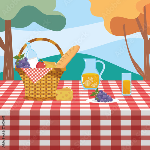 hamper with grape and milk bottle with orange juice