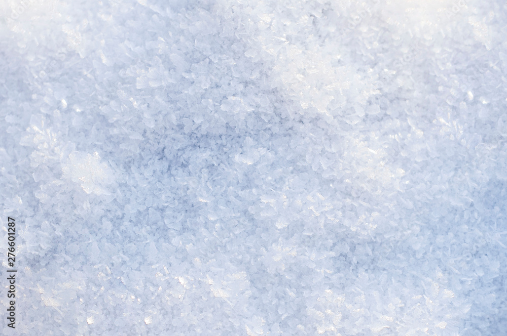 the first snow, the texture of the snow, snow abstract background with blue tint