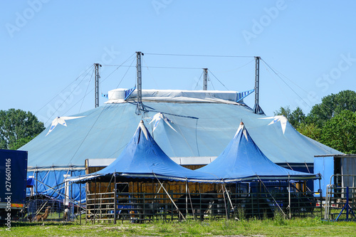 traveling circus blue tent against a blue sky © Zigmunds