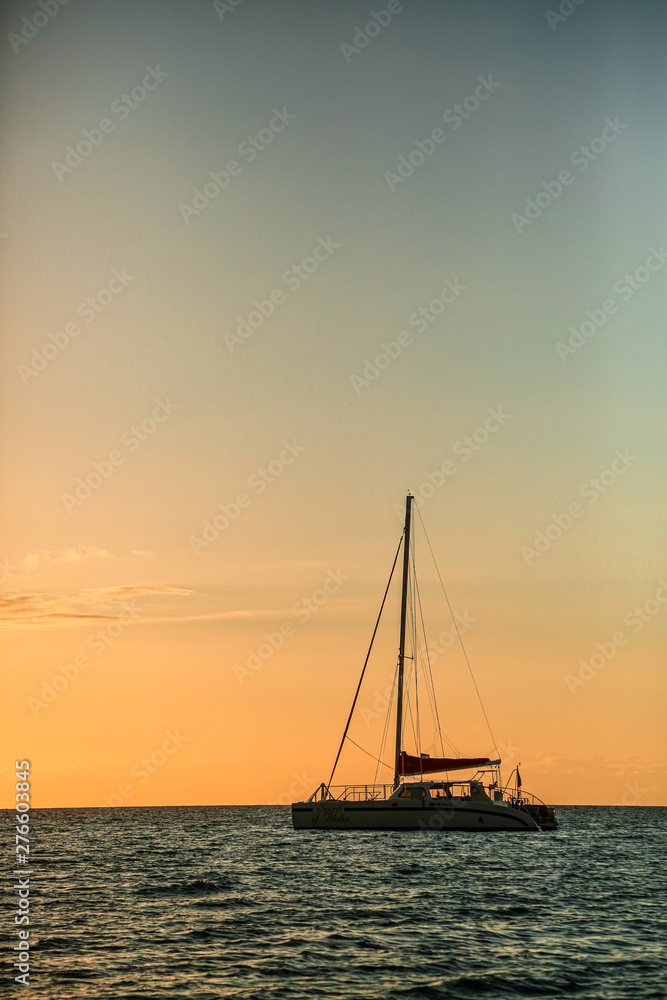 sailboat at sunset in hawaii
