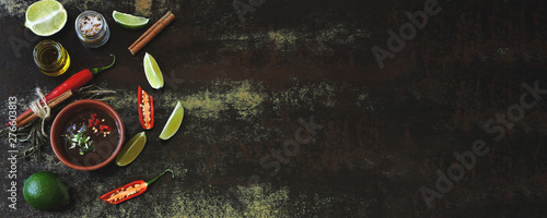 Food banner. Chili lime sauce Ingredients for chili sauce and lime. Chili, limes and spices. Vegan food. Dietary healthy food. Copy space. Flat Lay.