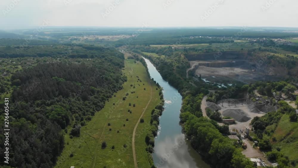 Drone Fast Flying Over River and Near Granite Quarry in Temperate Climate Zone. Europe, Ukraine, Vinnytsia. Aerial. Pivdenny Buh. Drone Fast Flying Over River and Near Granite Quarry in Temperate Climate Zone. Europe, Ukraine, Vinnytsia. Aerial. Pivdenny Buh.