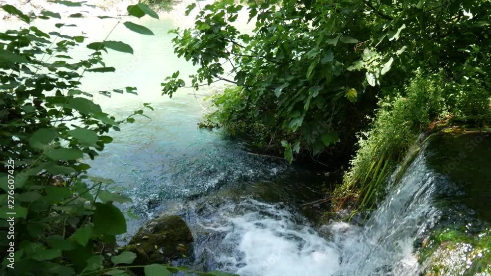 Calore river, Castelcivita, Campania, Salerno, Italy: waterfall on Calore river, water source inside of river. Close up of water stream Calore river, Castelcivita, Campania, Salerno, Italy: waterfall on Calore river, water source inside of river. Close up of water stream