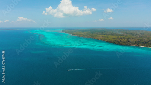 Seascape: Tropical islands with coral reefs in the blue water of the sea, top view. Balabac, Palawan, Philippines. Summer and travel vacation concept.