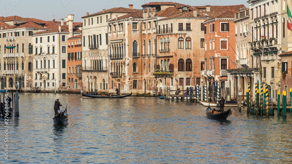 VENICE, ITALY - JAN 1, 2016: Water Canal of Venice, Italy. Narrow Streets of Venice. Water transportation, gondola, boats. Architecture buildings of Italy.