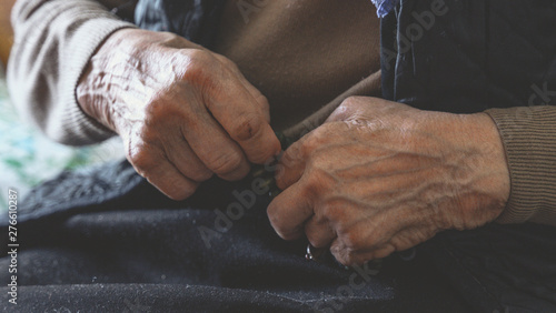 old wrinkled hands of elderly woman. Coronavirus risk group. COVID virus infection.