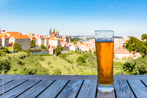 Photography Glass of beer against view of the  Prague Castle and Saint Vitus Cathedral in Prague