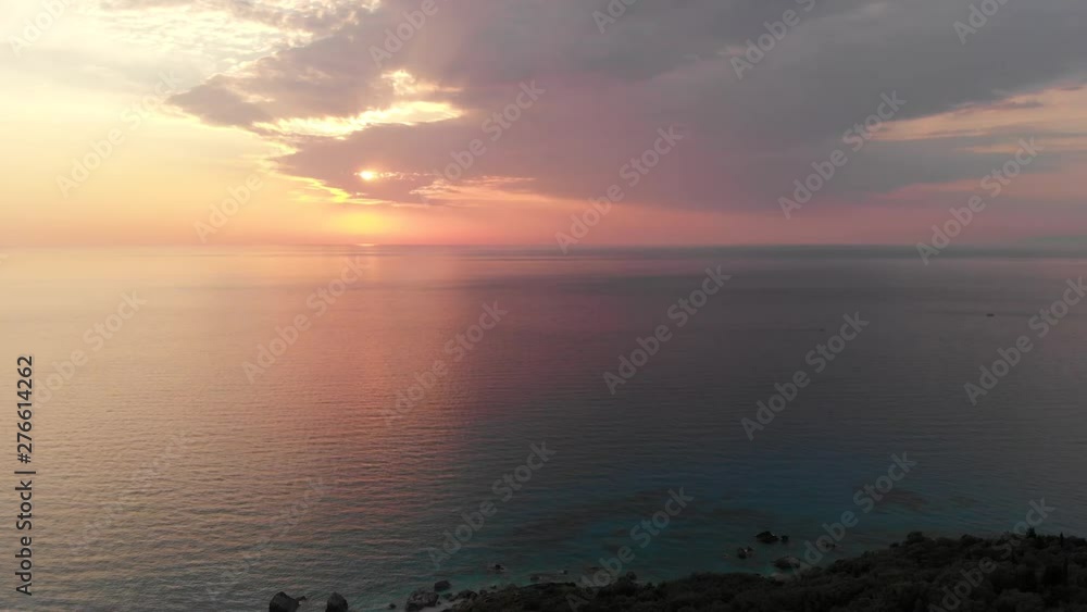 Aerial panoramic view of calm sunset over ocean, summer background Aerial panoramic view of calm sunset over ocean, summer background