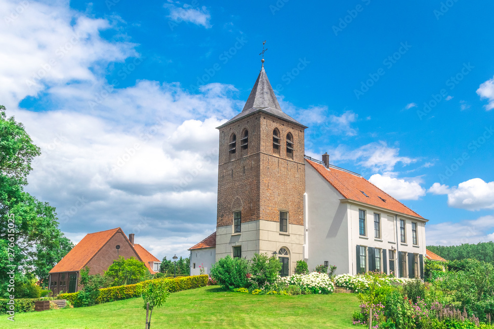 A old traditional Dutch church in the village of Ooij, Holland