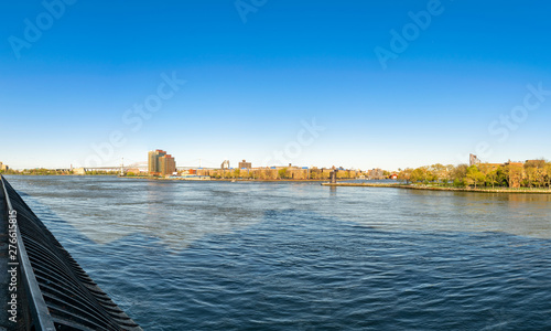 View across New York City's East River, toward the Triborough Bridge and parts of Roosevelt Island and Queens