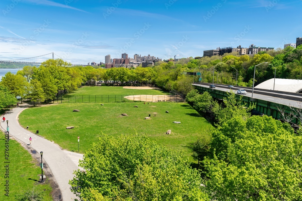 Arial view across Riverbank State Park in New York City, with Upper Manhattan and the George Washington Bridge in the background Arial view across Riverbank State Park in New York City, with Upper Manhattan and the George Washington Bridge in the background