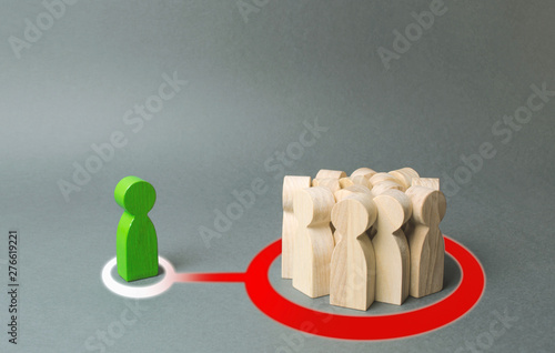 A crowd of people representing the majority influence a stranger. Rejected from society, lonely. Society imposes its own rules and regulations, the eradication of dissent and distinctive qualities.