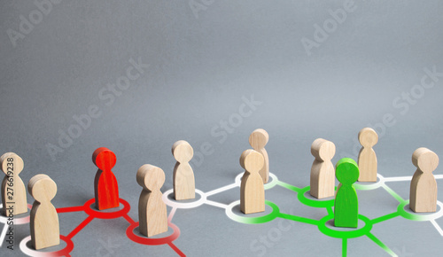 red and green figures of people influence on their surroundings people through communication and social networks. Pressure, influence on public opinion, communicating, point of view, mind control. photo