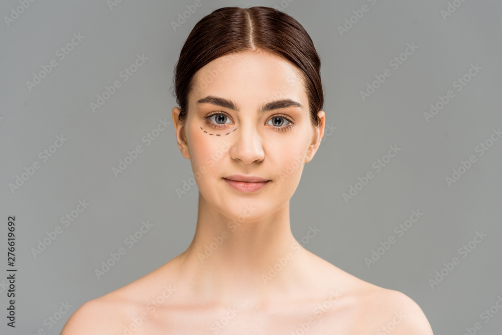 naked woman with marks on face looking at camera isolated on grey naked woman with marks on face looking at camera isolated on grey