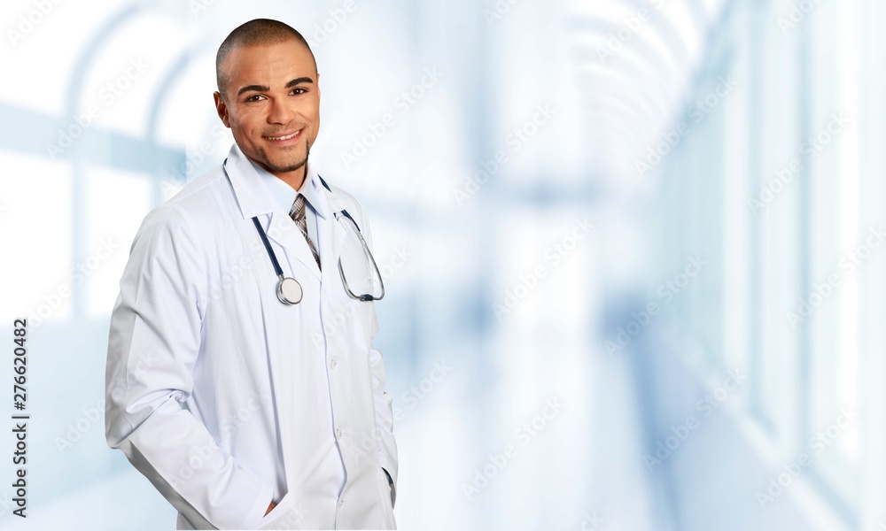 Young beautiful nurse on blurred hospital background Young beautiful nurse on blurred hospital background
