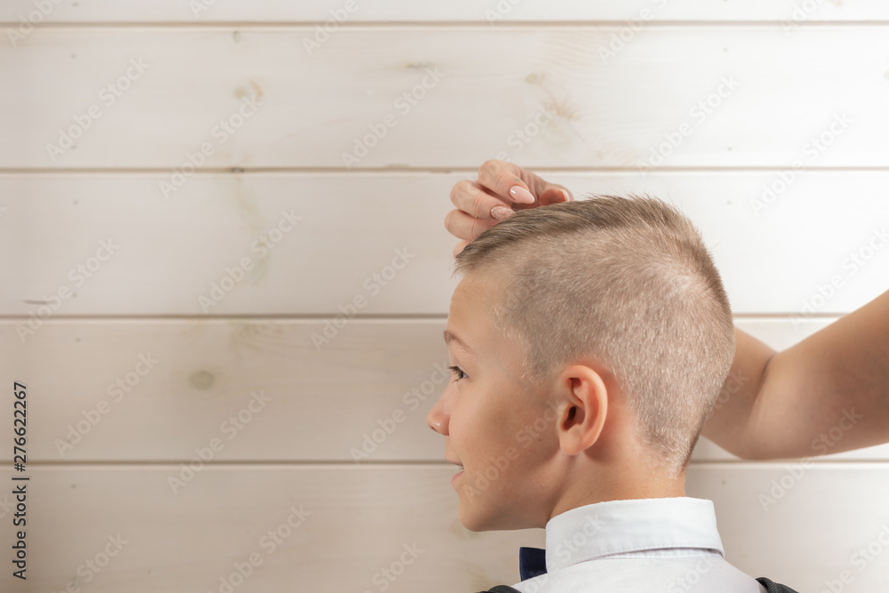 Obraz premium A 10-year-old boy prepares for school after a long summer break. Back to school. Children's portrait.