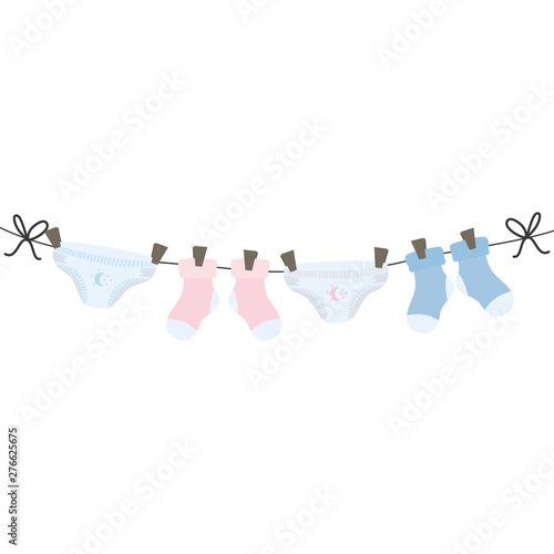 baby diapers and socks clothes hanging in wire