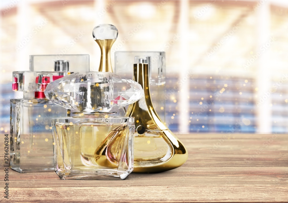 Aromatic Perfume bottles on background - obrazy, fototapety, plakaty 