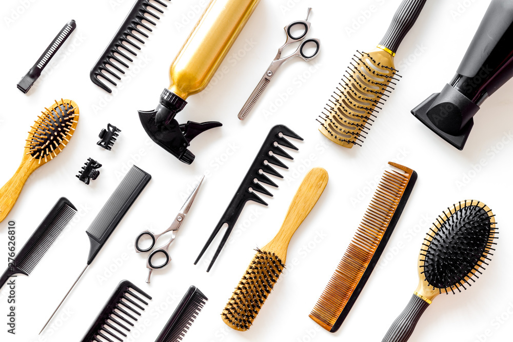 professional accessories of hairdresser with combs and spray on work desk white background top view pattern professional accessories of hairdresser with combs and spray on work desk white background top view pattern