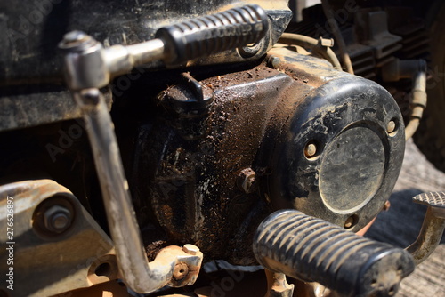 Old motorbike, damaged, oil leak, waiting for repair