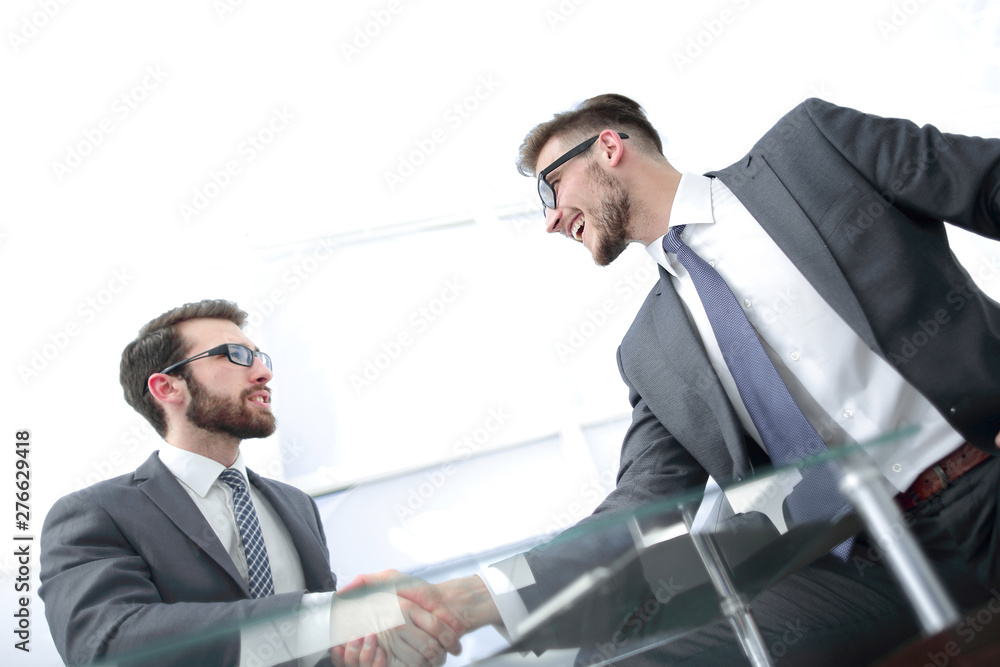 close up.business partners shaking hands. close up.business partners shaking hands.