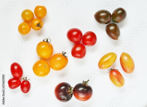 different varieties of cherry tomatoes. small tomatoes of different colors and types.