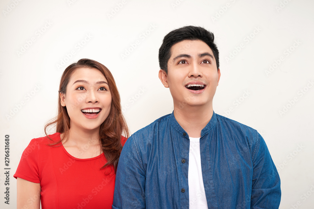 happy thoughtful couple. looking away on white background happy thoughtful couple. looking away on white background