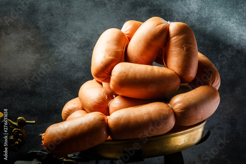 closeup big bunch of short thick wieners rolled in spiral