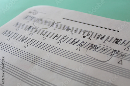 Handwritten musical notes, music theory exercise on paper