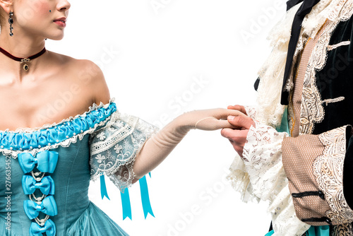 cropped view of gentleman holding hands with victorian woman in blue dress isolated on white