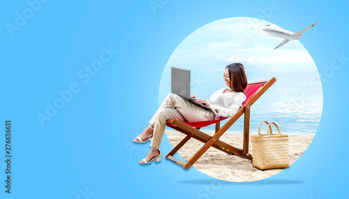 Asian business woman working with laptop sitting in the beach chair © Leo Lintang