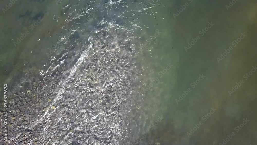 Aerial overhead shot, mouth of a creek with salmon staging to spawn. Bear Lake, Seward, Alaska. Aerial overhead shot, mouth of a creek with salmon staging to spawn. Bear Lake, Seward, Alaska.