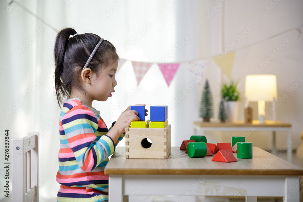 Kid's creativity, Child little asian girl playing colorful building blocks on the desk in the class room at home, Educational concept for school Kid's creativity, Child little asian girl playing colorful building blocks on the desk in the class room at home, Educational concept for school