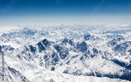 Aerial view of central Karakoram or Karakorum range in Pakistan, second highest mountain range in the world., with snowcapped mountains, peaks, valleys & glaciers. photo