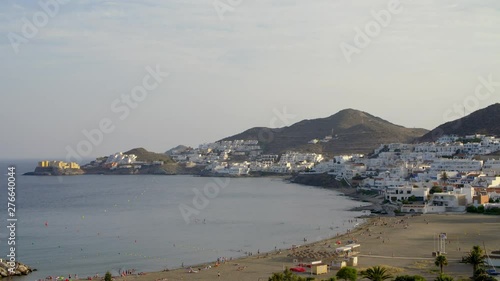 Village of San José, in the province of Almería, in the south of Spain. Wide shot of a landscape with white houses facing the beach and the Mediterranan sea. Mediterranean town. photo