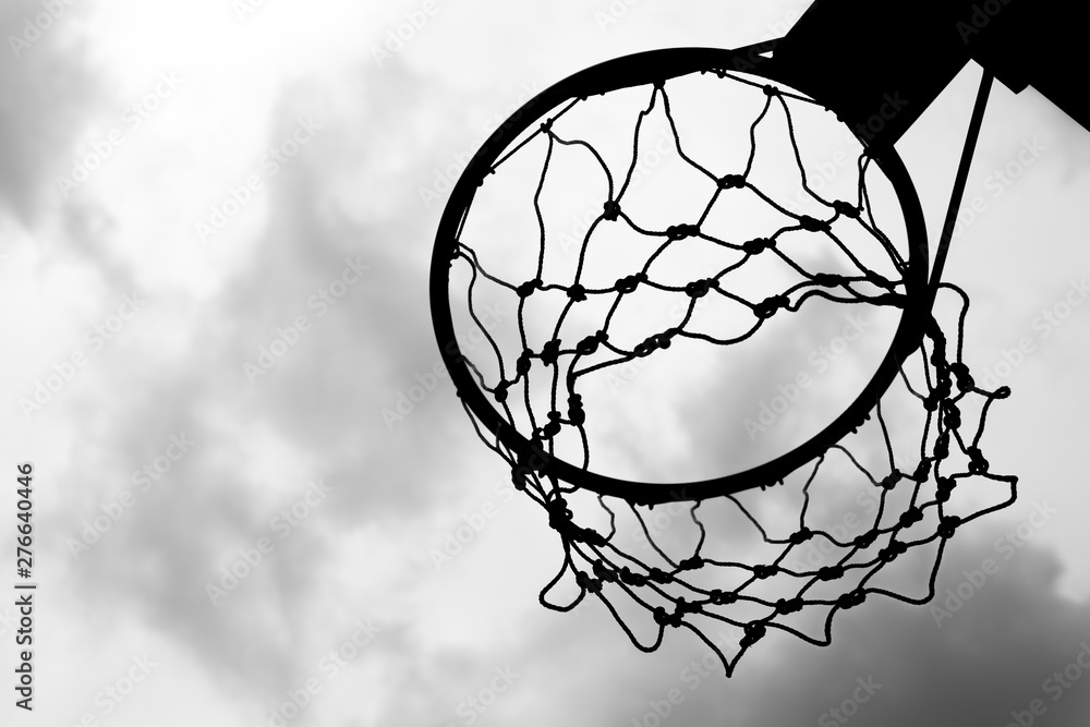 Black and white of Old basketball hoop on sky background and clouds Stock  Photo | Adobe Stock